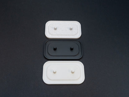 Philips Sonicare electric toothbrush stands that hold two toothbrushes shown in white, black and white stone effect.