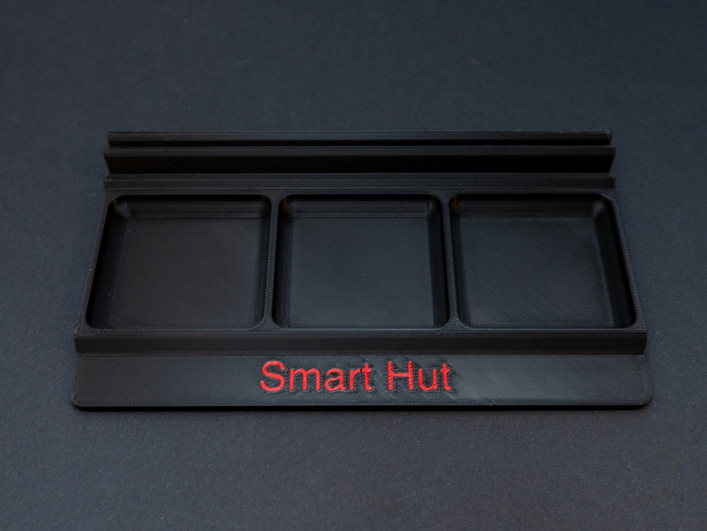 Black board game card and token holder organiser with 2 rows for cards and 3 trays for tokens. Has space at the front for personalisation photo shows red text, Suitable for a range of board games such as Wingspan, Wyrmspan, Finspan and many more.