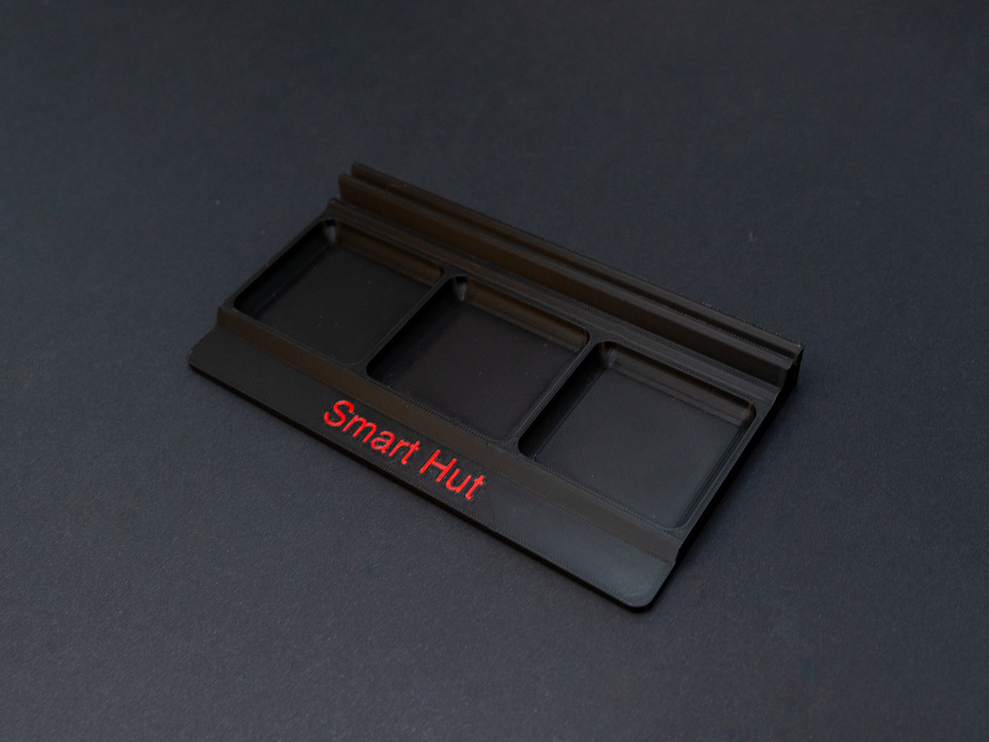 Black board game card and token holder organiser with 2 rows for cards and 3 trays for tokens. Has space at the front for personalisation photo shows red text, Suitable for a range of board games such as Wingspan, Wyrmspan, Finspan and many more.