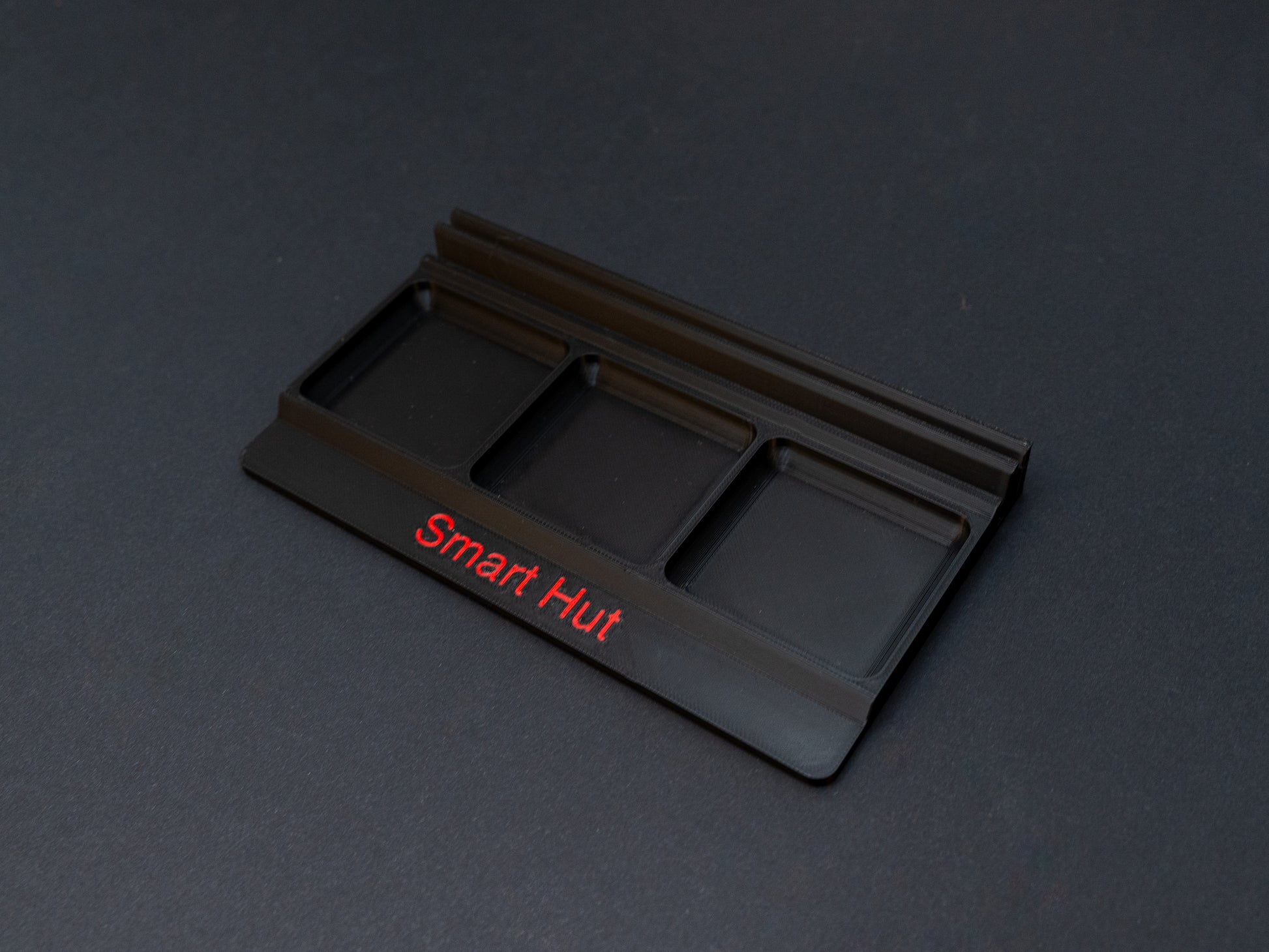 Black board game card and token holder organiser with 2 rows for cards and 3 trays for tokens. Has space at the front for personalisation photo shows red text, Suitable for a range of board games such as Wingspan, Wyrmspan, Finspan and many more.