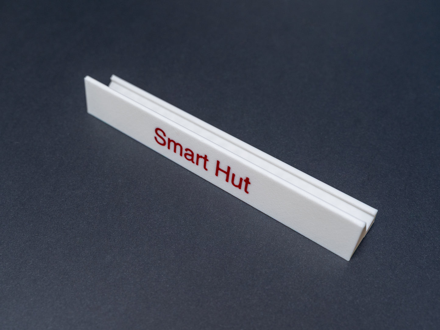 Personalised white scrabble and bananagrams tile holder. Shown with the personalisation in red text 