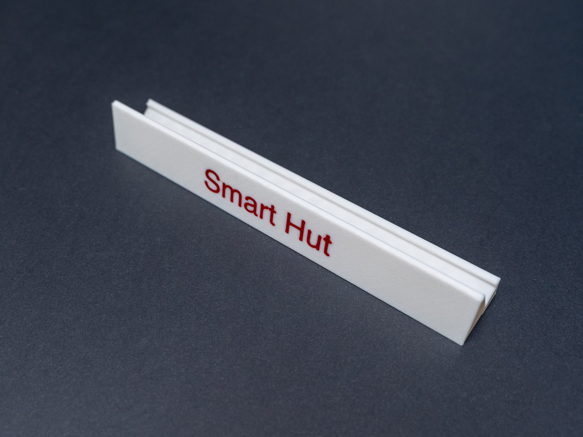 Personalised white scrabble and bananagrams tile holder. Shown with the personalisation in red text 