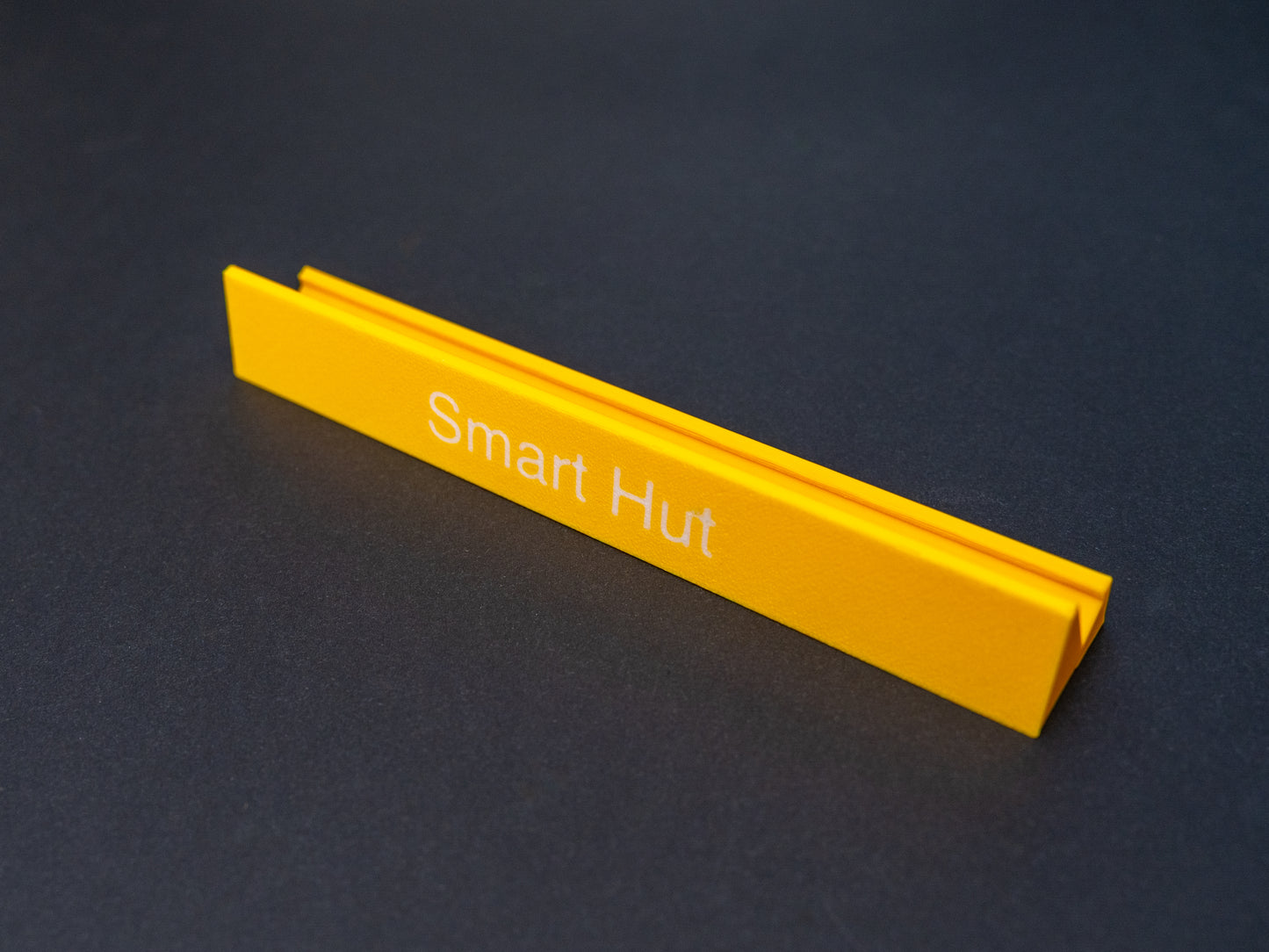 Personalised yellow scrabble and bananagrams tile holder. Shown with the personalisation in white text at the front 