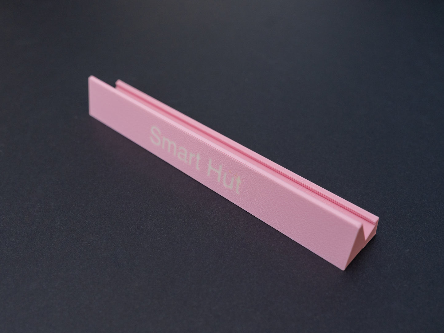 Personalised pink scrabble and bananagrams tile holder. Shown with the personalisation in white text at the front 