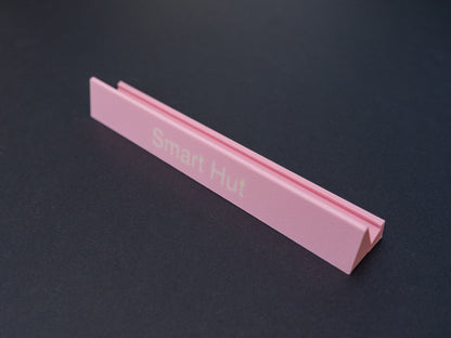 Personalised pink scrabble and bananagrams tile holder. Shown with the personalisation in white text at the front 