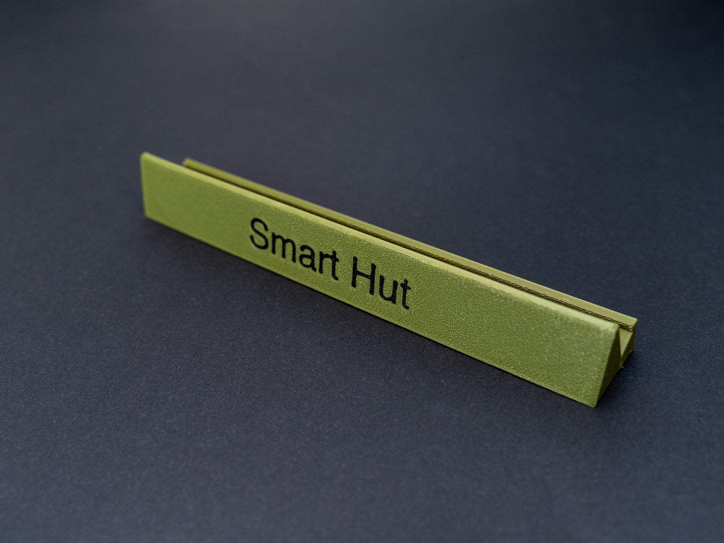 Personalised olive green scrabble and bananagrams tile holder. Shown with the personalisation in black text at the front 