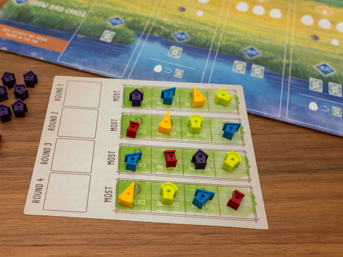 Wingspan bird houses are a player token upgrade for the wooden cubes that come with the original board game. Full set for 5 players in yellow, green, blue, red and purple.