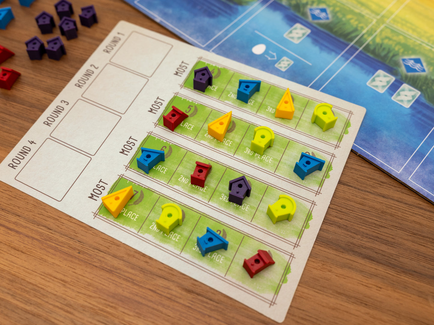 Wingspan bird houses are a player token upgrade for the wooden cubes that come with the original board game. Full set for 5 players in yellow, green, blue, red and purple.