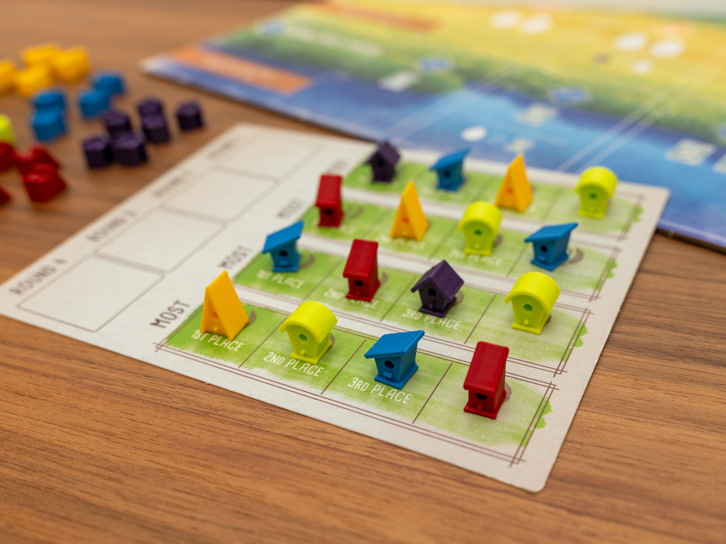 Wingspan bird houses are a player token upgrade for the wooden cubes that come with the original board game. Full set for 5 players in yellow, green, blue, red and purple.