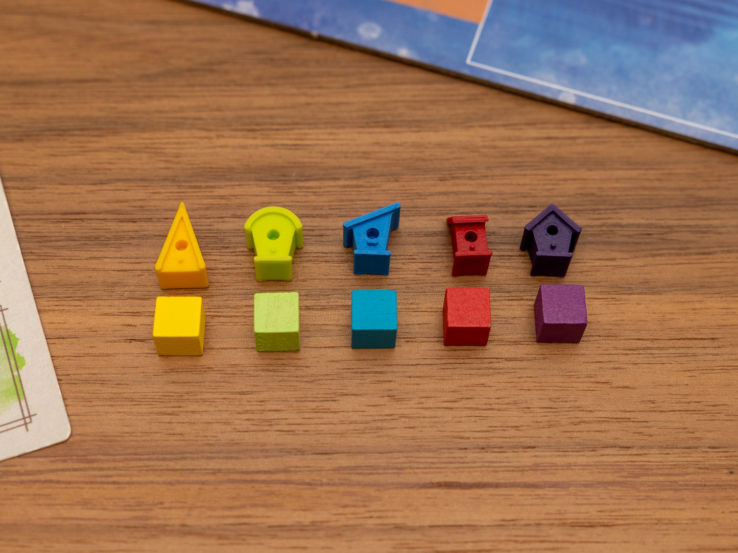 Wingspan bird houses are a player token upgrade for the wooden cubes that come with the original board game. Full set for 5 players in yellow, green, blue, red and purple.