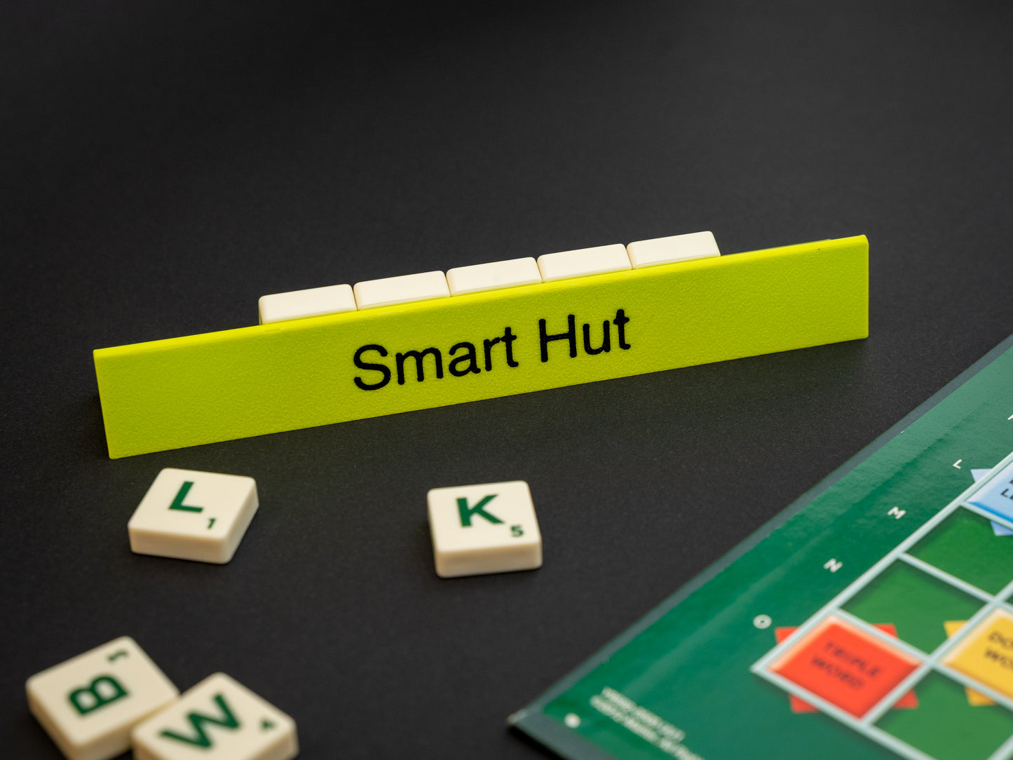 Personalised apple green scrabble and bananagrams tile holder. Shown with the personalisation in black text at the front and tiles in the tray at the back.